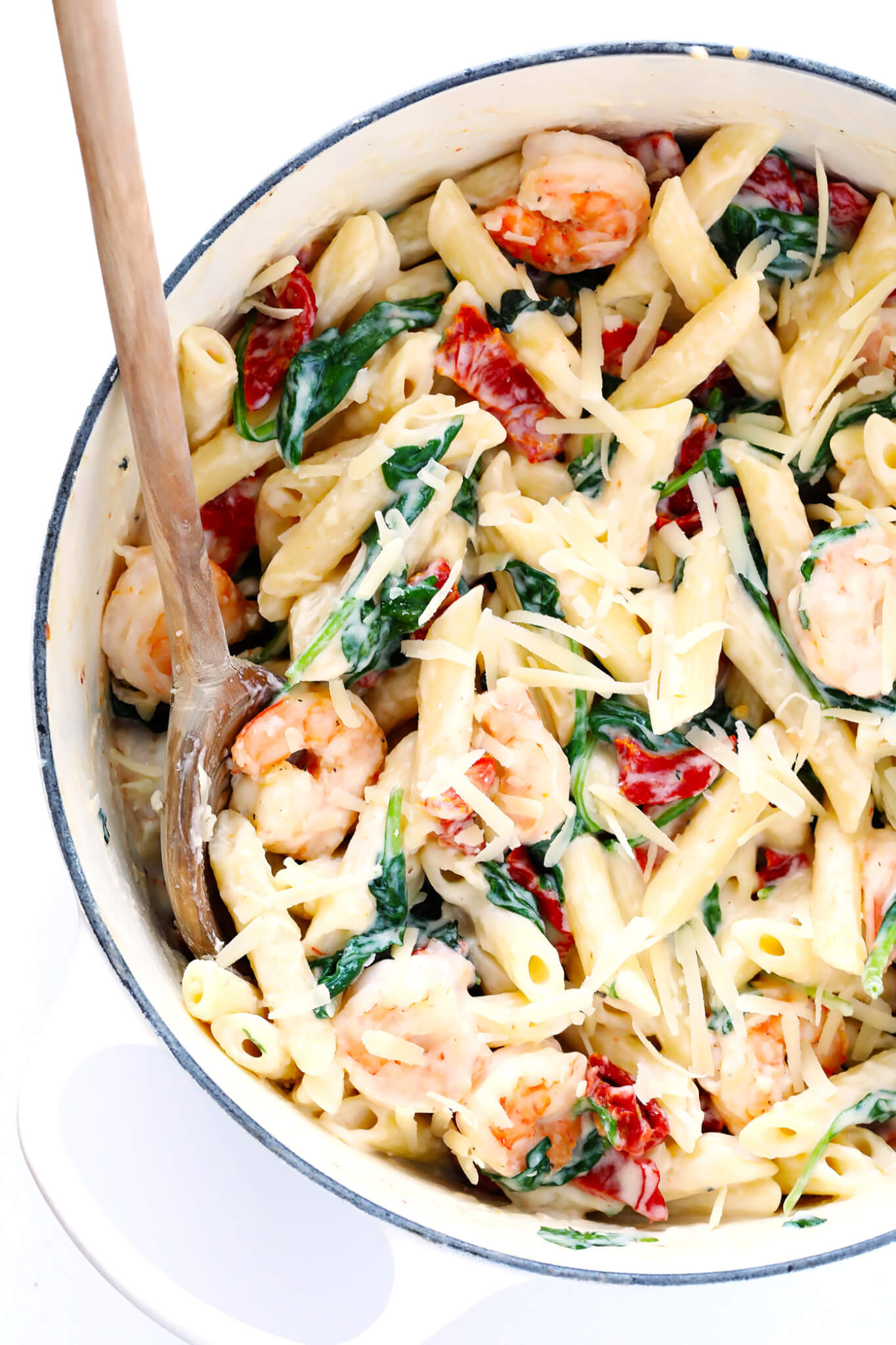 This Creamy Shrimp Florentine Pasta recipe is made with lots of Parmesan, sun-dried tomatoes and spinach, and tossed in a heavenly cream sauce. So delicious! | gimmesomeoven.com