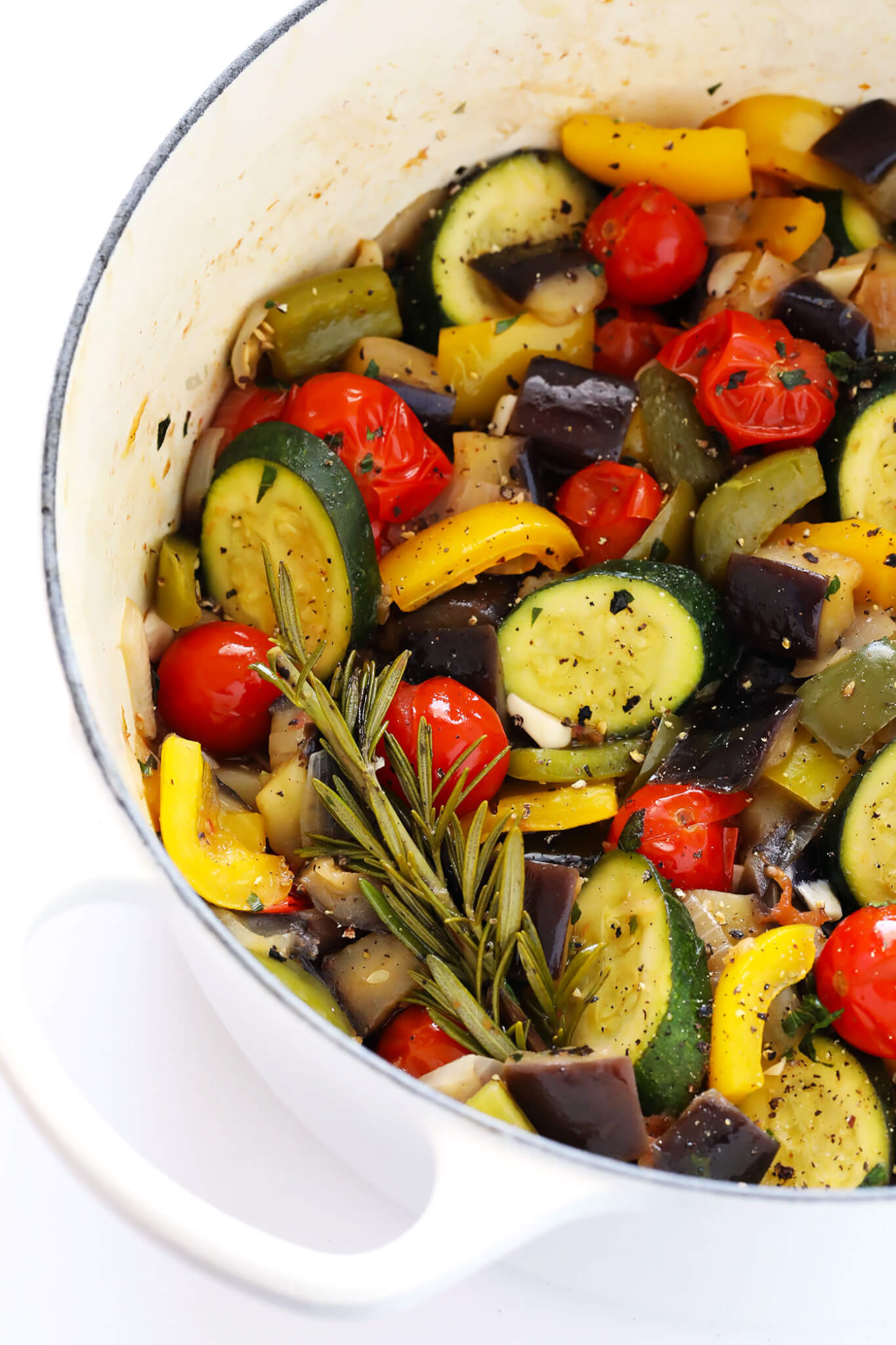 This ultra-easy Ratatouille recipe is the perfect way to use up summer vegetables (zucchini, eggplant, tomato, bell peppers, you name it!), and tastes absolutely delicious when served with crusty French bread (or pasta or quinoa or rice). An awesome healthy dinner idea, and one that's easy to customize with your favorite ingredients. | gimmesomeoven.com (Gluten-Free / Vegetarian / Vegan)