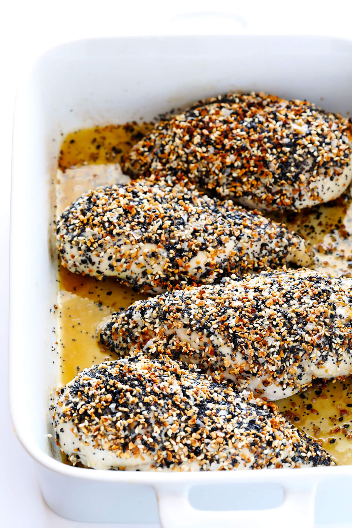 This "Everything" Chicken recipe is made with yummy everything bagel seasoning, and baked in the oven to juicy, tender, delicious perfection. It's an easy and gluten-free dinner idea that everyone will love, especially with those garlic, poppyseed, sesame flavors! | gimmesomeoven.com