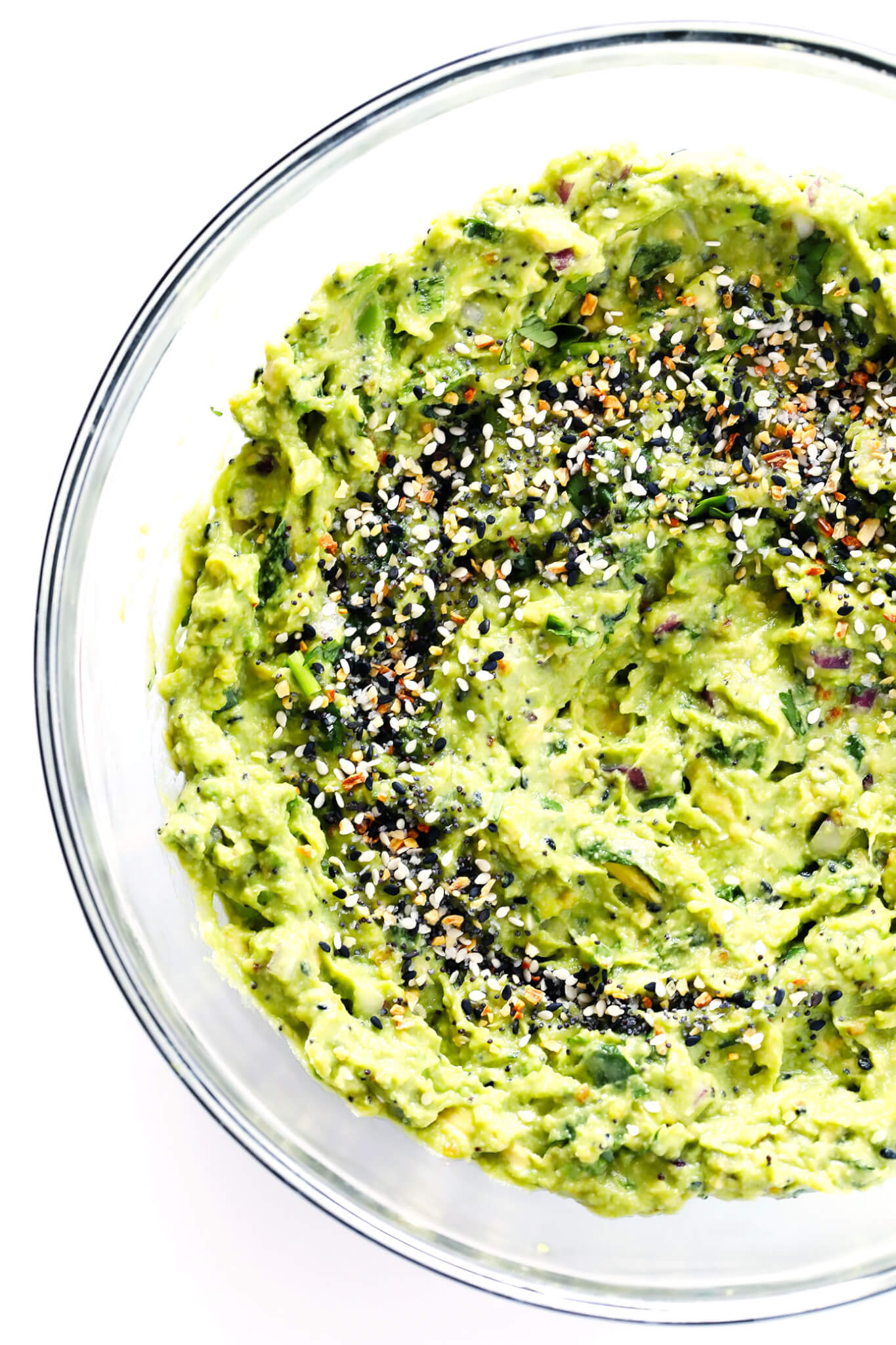 This "Everything" Guacamole recipe is kicked up a delicious notch with some everything bagel seasoning. It's the perfect savory appetizer dip for a party! | gimmesomeoven.com (Vegetarian | Gluten-Free | Vegan)