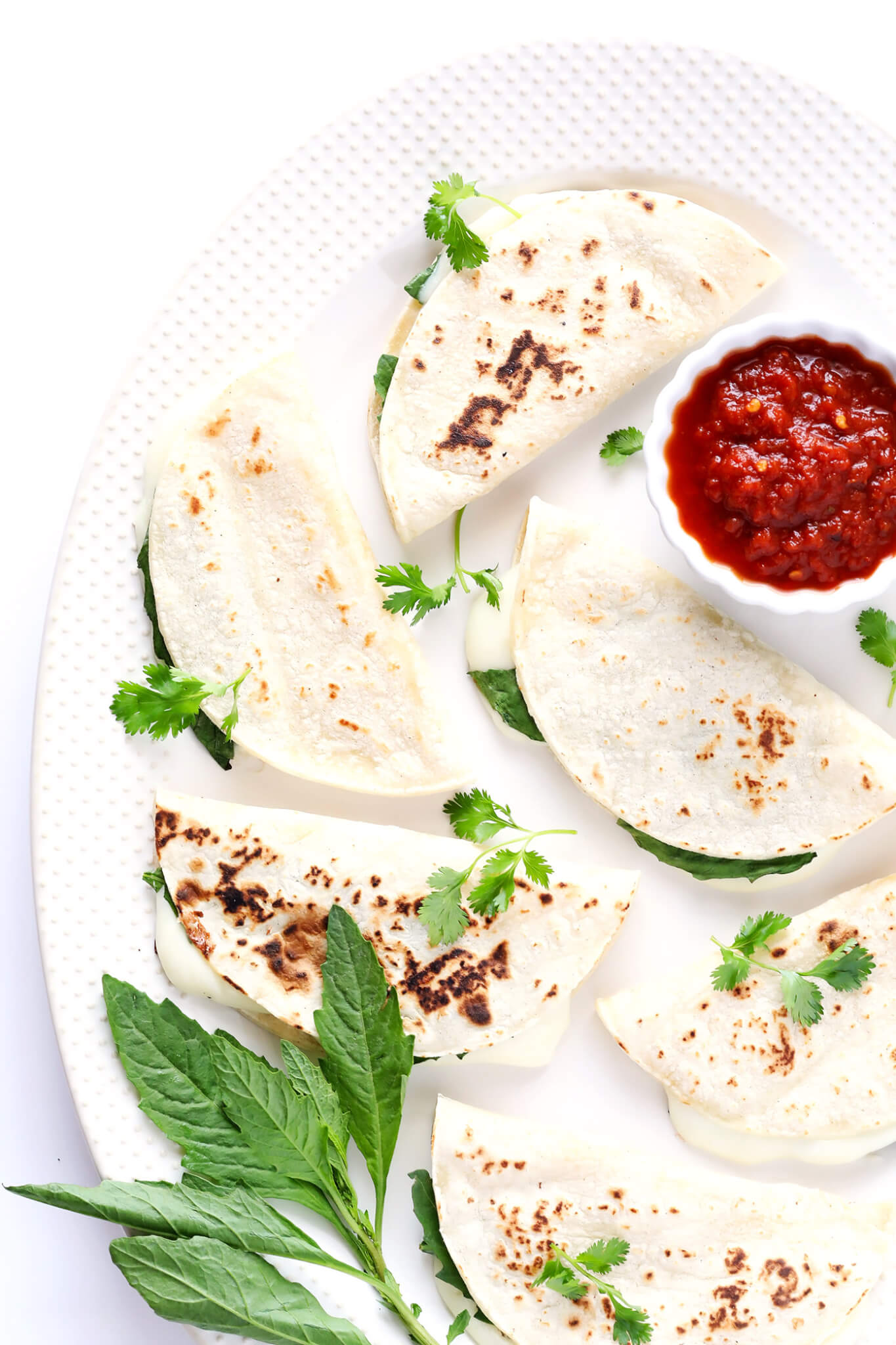 These amazing Oaxacan Cheese Quesadillas are made with just 3 simple ingredients, take about 3 minutes to make, and are full of BIG flavor! Serve them up with your favorite salsa as a delicious easy dinner or appetizer. | gimmesomeoven.com (Mexican / Vegetarian / Gluten-Free)