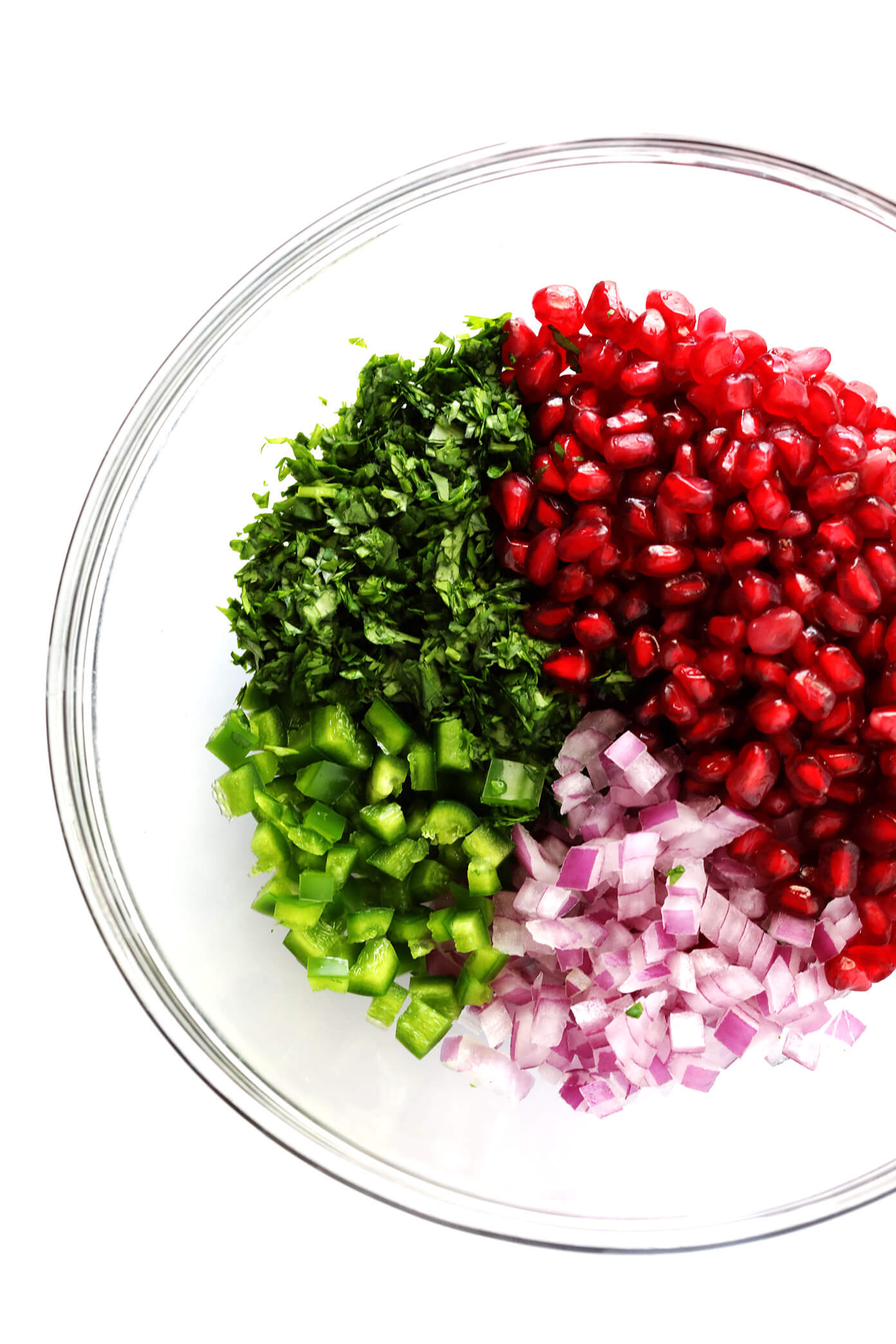 This 5-Ingredient Pomegranate Salsa is so juicy and sweet, and it only takes a few minutes to make! Just grab some POM-POMs, red onion, cilantro, jalapeño and a lime, and you're ready to go!